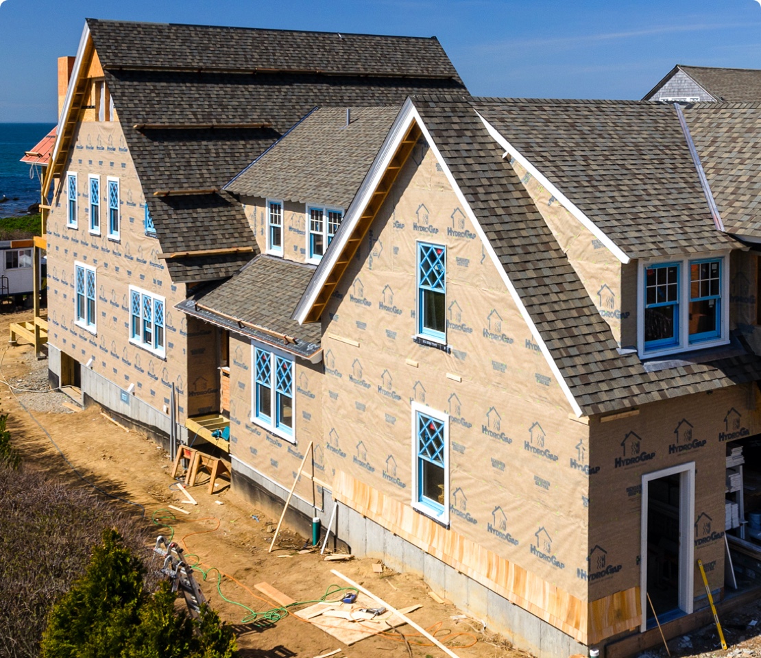 Side of a large home covered in HydroGap drainable housewrap.