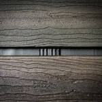 Close up of a Batten UV strip installed behind wood open joint cladding