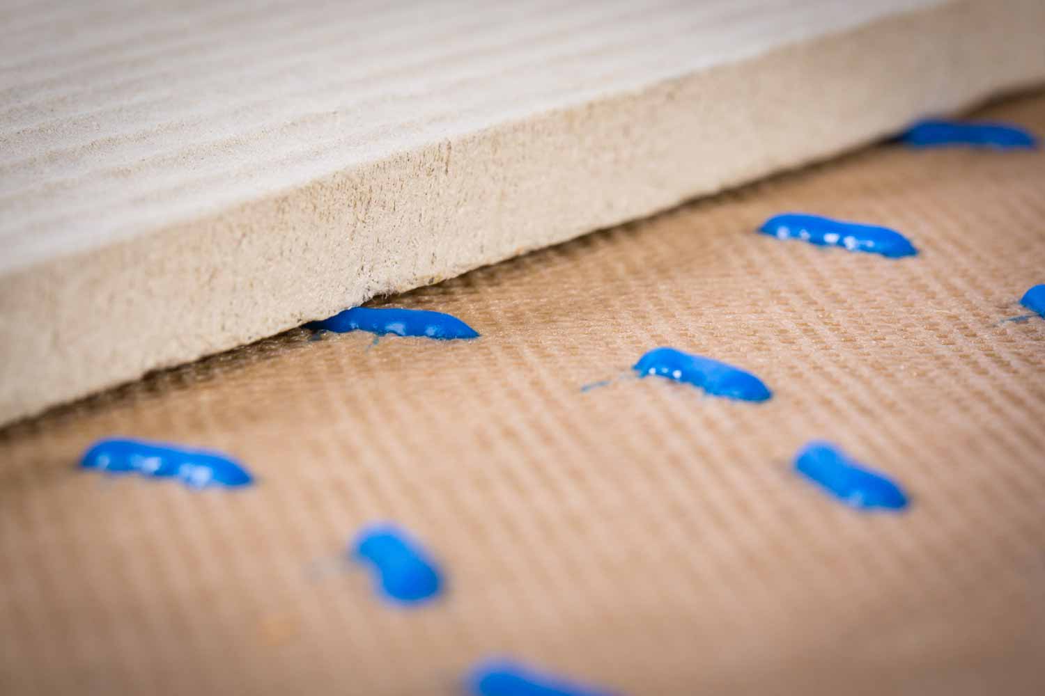 Detailed shot of the blue HydroGap 1-millimeter spacers fitting snuggly behind exterior cladding