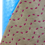 Up close visual of the patented pink, one-millimeter spacers featured on HydroGap products